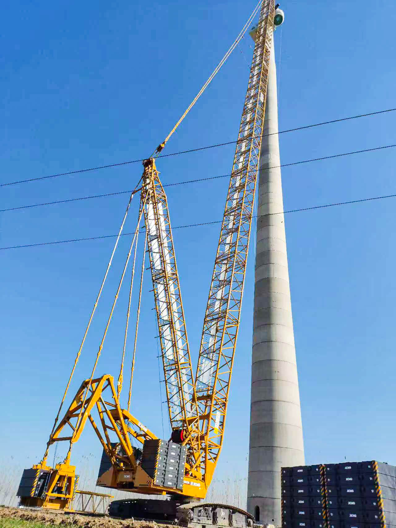160米高空精准“搭积木”：yl23455永利XLC15000M分体吊装6.25兆瓦风机全纪录